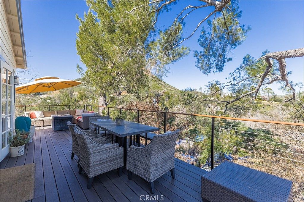 Newly constructed circular guest yurt set among trees