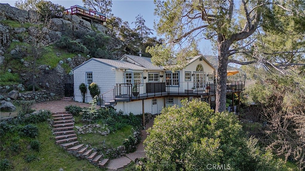 29068 Lake Dr, a charming lakeside cottage nestled among mature oaks in the Santa Monica Mountains